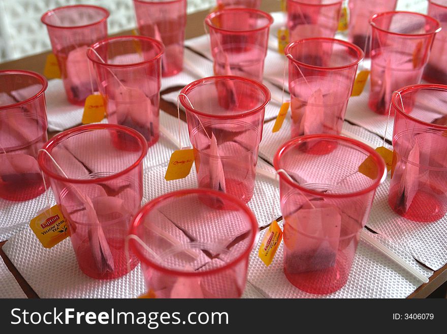 Plastic glasses with tea on a table