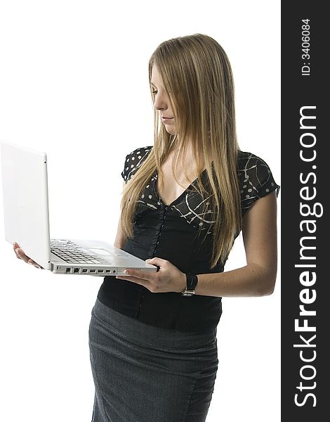 Woman standing with a white laptop computer against a white backdrop. Woman standing with a white laptop computer against a white backdrop.