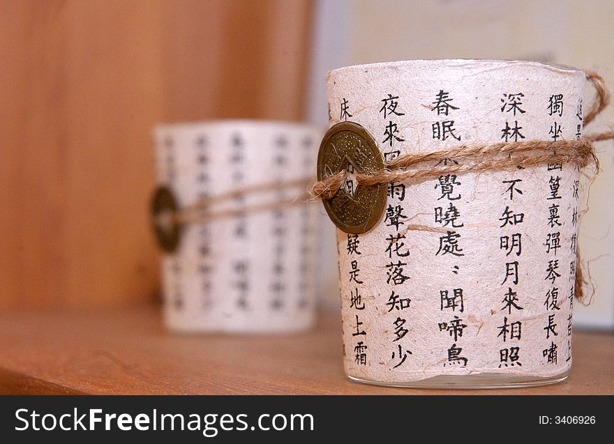 Two white cups decorated wit chinesse caligraphy. Two white cups decorated wit chinesse caligraphy