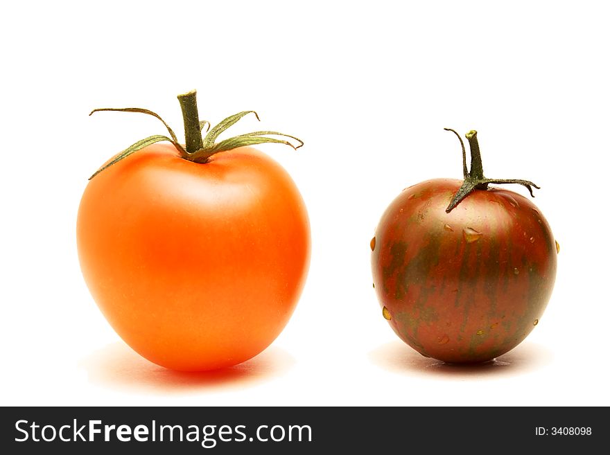 Close up of a red round tomato and a plum-like tomato on white background. Close up of a red round tomato and a plum-like tomato on white background