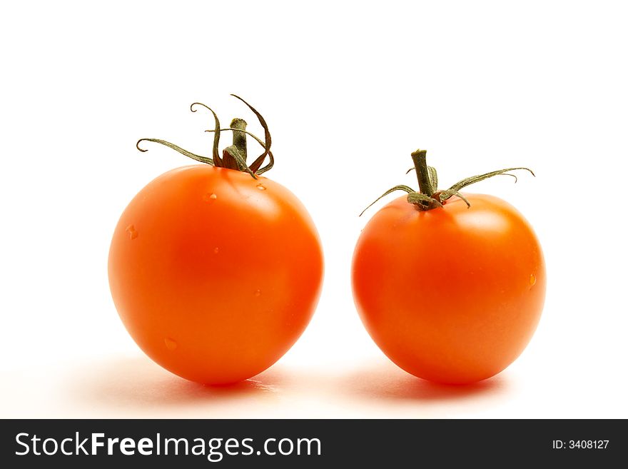 Close up of two red round tomato on white background. Close up of two red round tomato on white background