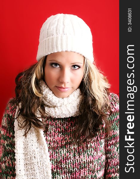 Winter portrait of a beautiful young woman with a cap and a scarf. Winter portrait of a beautiful young woman with a cap and a scarf