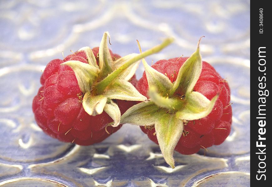 Raspberry on a dark blue background