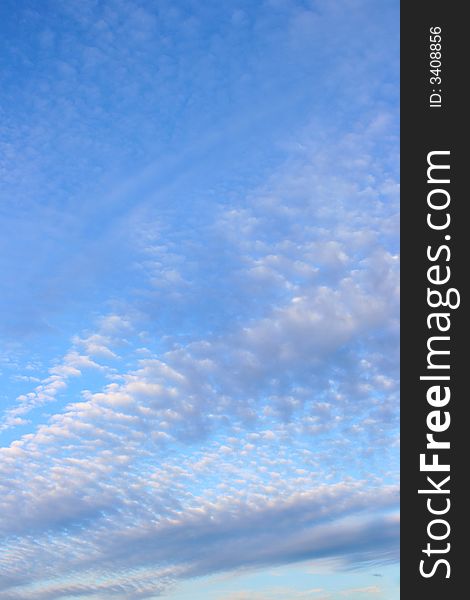 Fleecy clouds at evening, may be used as background