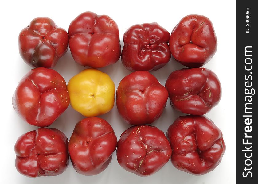 Red and yellow bellpeppers composition ower white