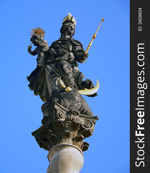 Statue holy virgin Marry on blue background