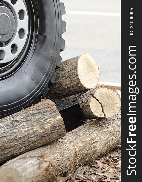 Heavy Duty tire wheel stepping over wooden logs