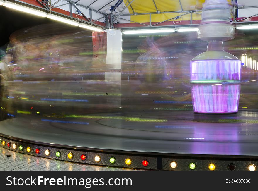 Colorful carousel lights in amusement park at night. Colorful carousel lights in amusement park at night