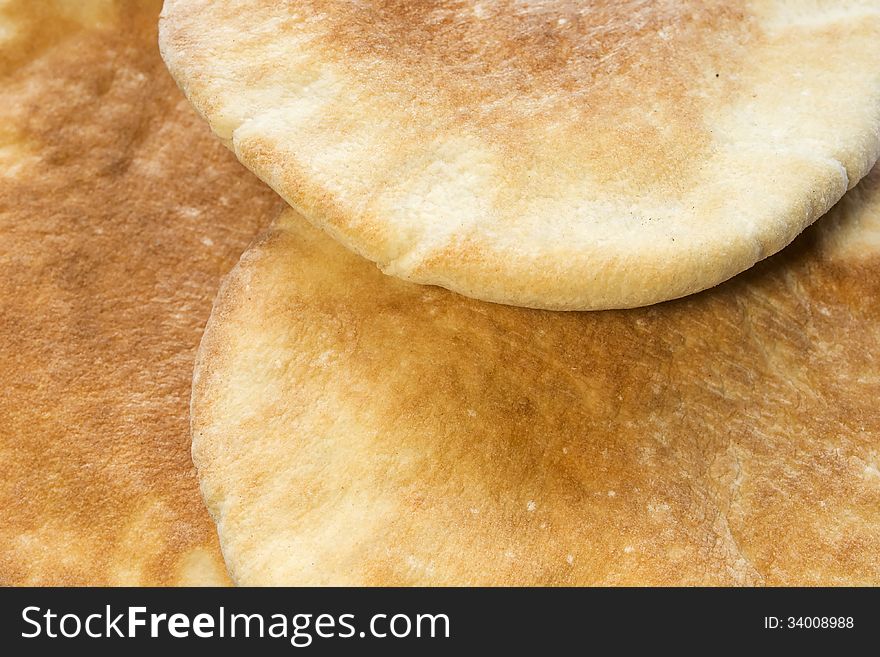 Some wheat flatbreads closeup as a background