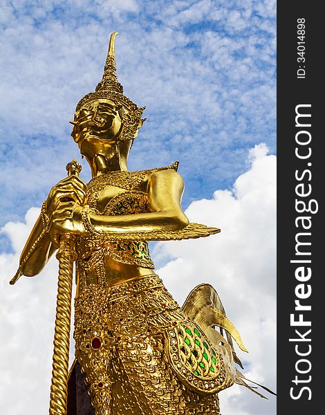 Statue of a kinnara in Wat Phra Kaew, Bangkok (Thailand).Generality in Thailand, any kind of art decorated in Buddhist church, temple pavilion, temple hall, monk's house etc. created with money donated by people to hire artist. They are public domain or treasure of Buddhism, no restrict in copy or use, no name of artist appear (but, if there is artist name, it only for tell who is the artist of work, not for copyright). This photo is taken under these conditions.