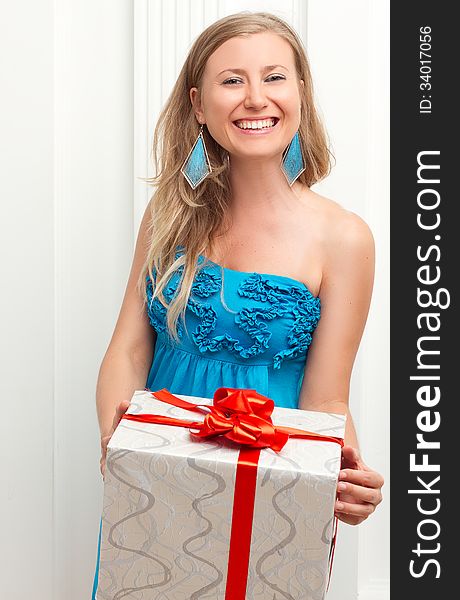 Picture of lovely woman in dress with present