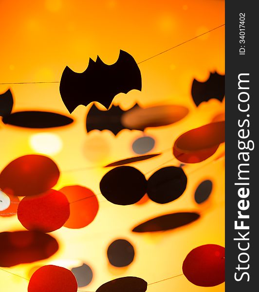 Halloween paper garlands on orange background. Halloween paper garlands on orange background