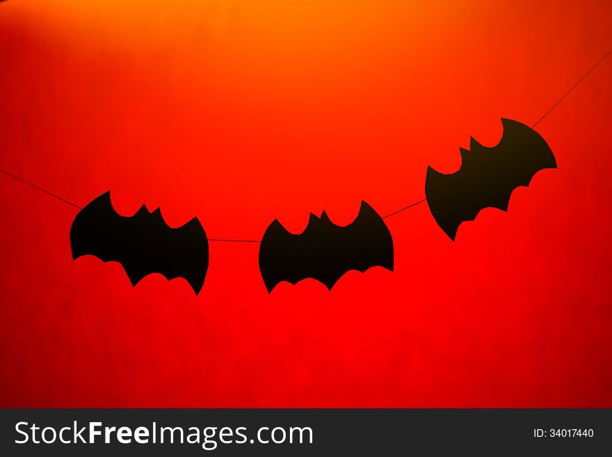 Halloween paper garlands on orange background. Halloween paper garlands on orange background