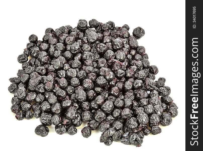 A pile of dried blueberries on a white background. A pile of dried blueberries on a white background.