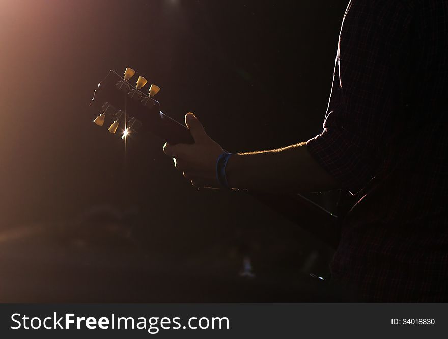 Guitarist silhouette performing on stage. Guitarist silhouette performing on stage