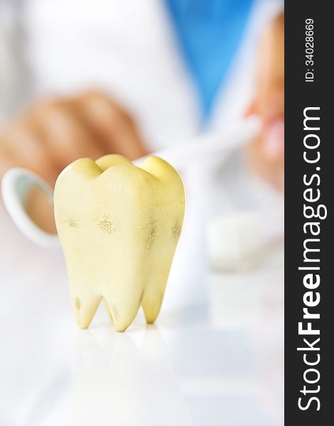 Molar with dentist background, dental hygiene concept