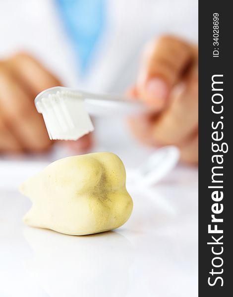 Molar with dentist background, dental hygiene concept