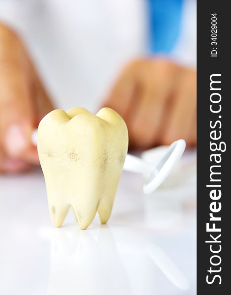 Molar with dentist background, dental hygiene concept