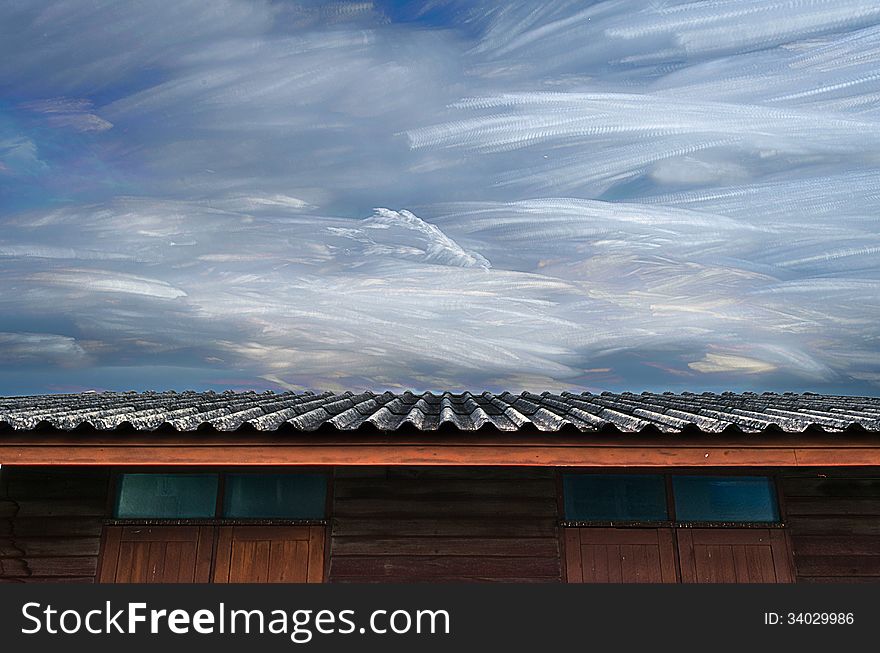 Moving Of Freezing Cloud In Blue Sky Over Roof Of Wooden House