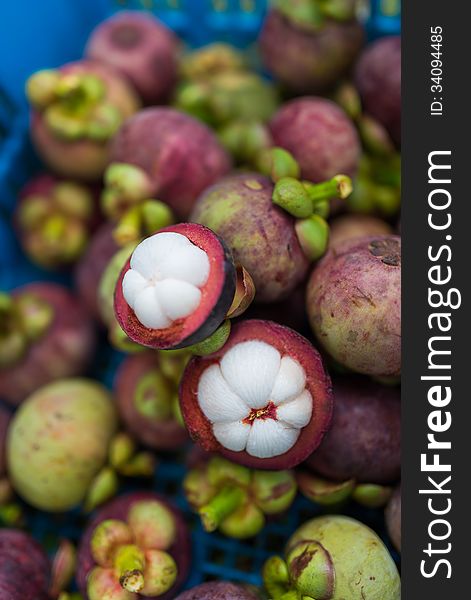 Peeled mangosteens in basket with blurred background