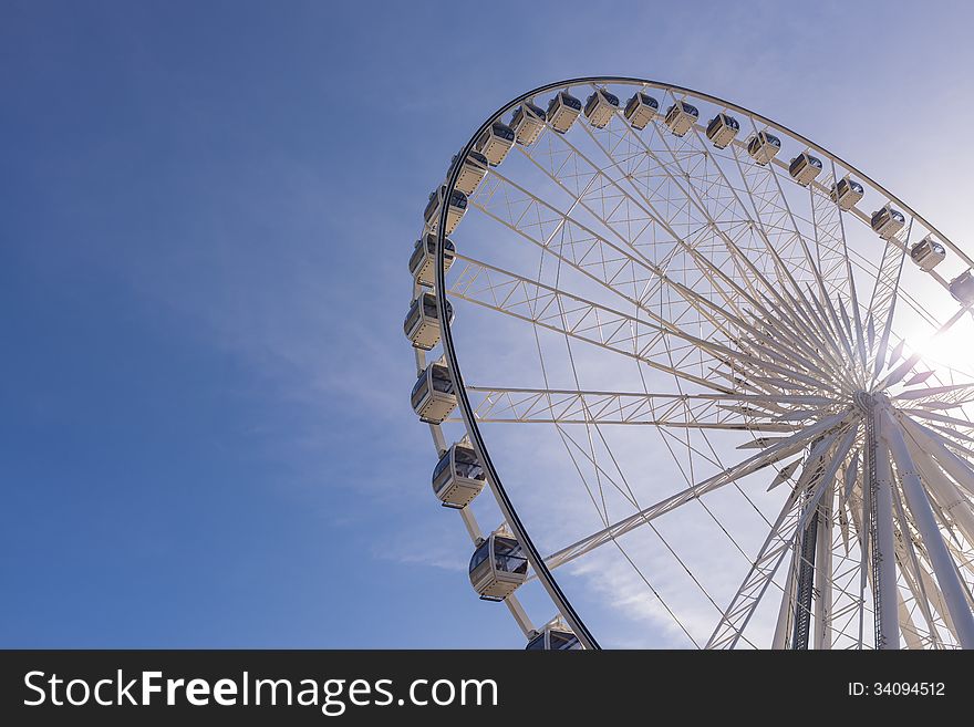 Big ferris wheel on clear blue sky