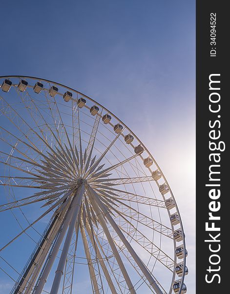 Big ferris wheel on clear blue sky