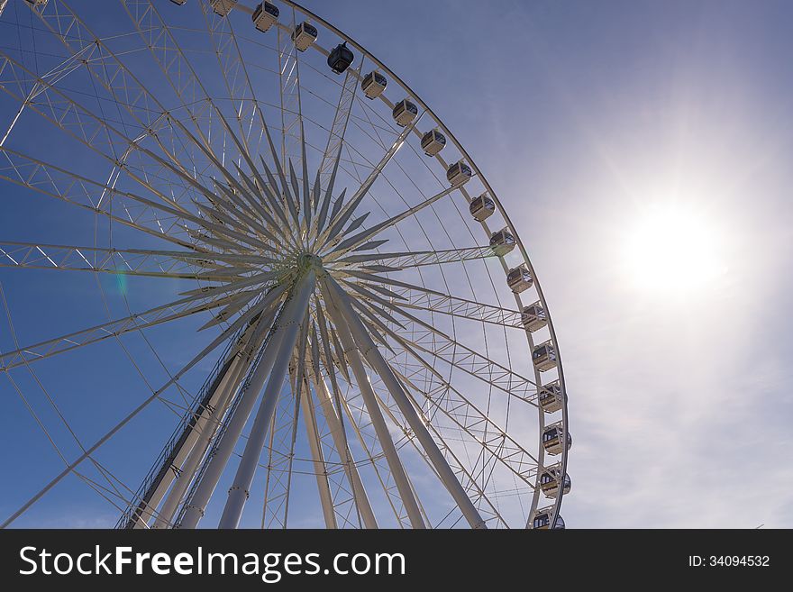 Big ferris wheel on clear blue sky