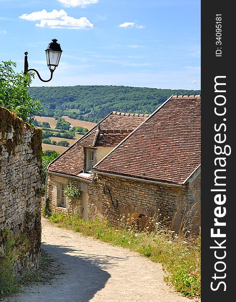 Lane through a village in the hills of Burgundy (France)