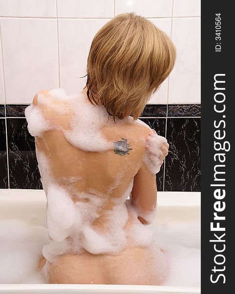 Girl in a foamy bath