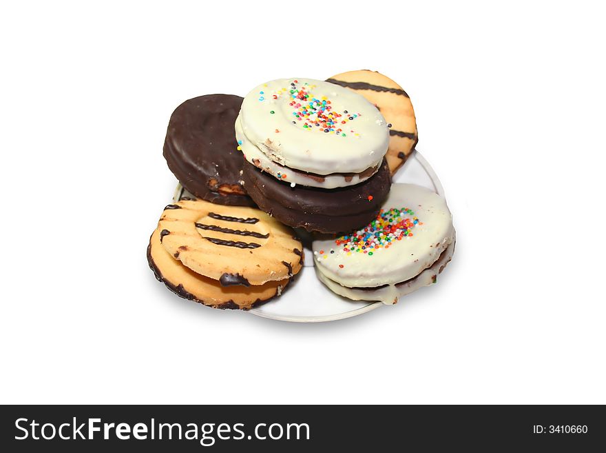 Isolated various types of cookies in saucer. Isolated various types of cookies in saucer