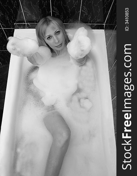 Girl in a foamy bath