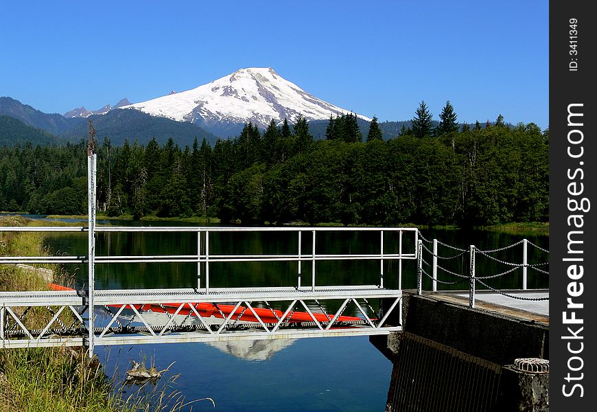 A shot of a small bridge with a mountain in the background. A shot of a small bridge with a mountain in the background.