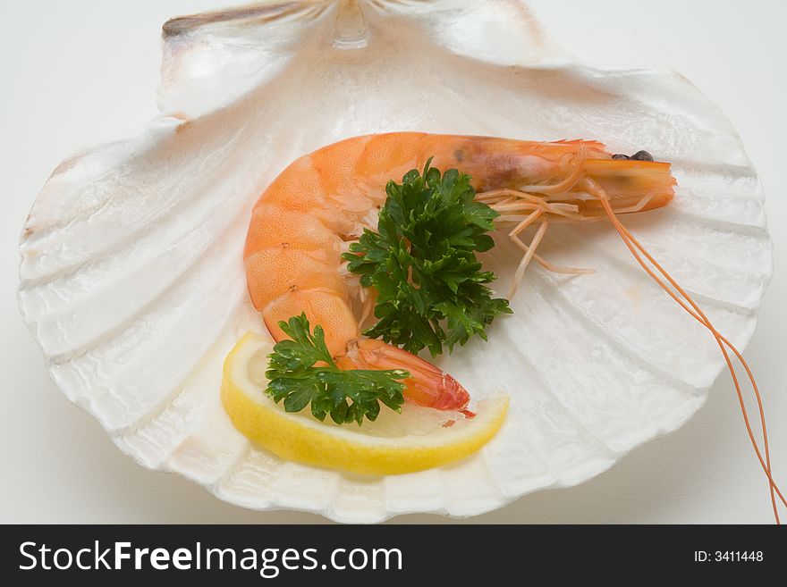 Decorated shrimp on a seashell