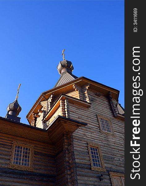 Wooden Christian church under the clear blue sky. Wooden Christian church under the clear blue sky.