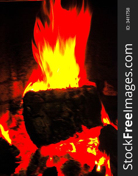 Blazing log in domestic fireplace. Blazing log in domestic fireplace