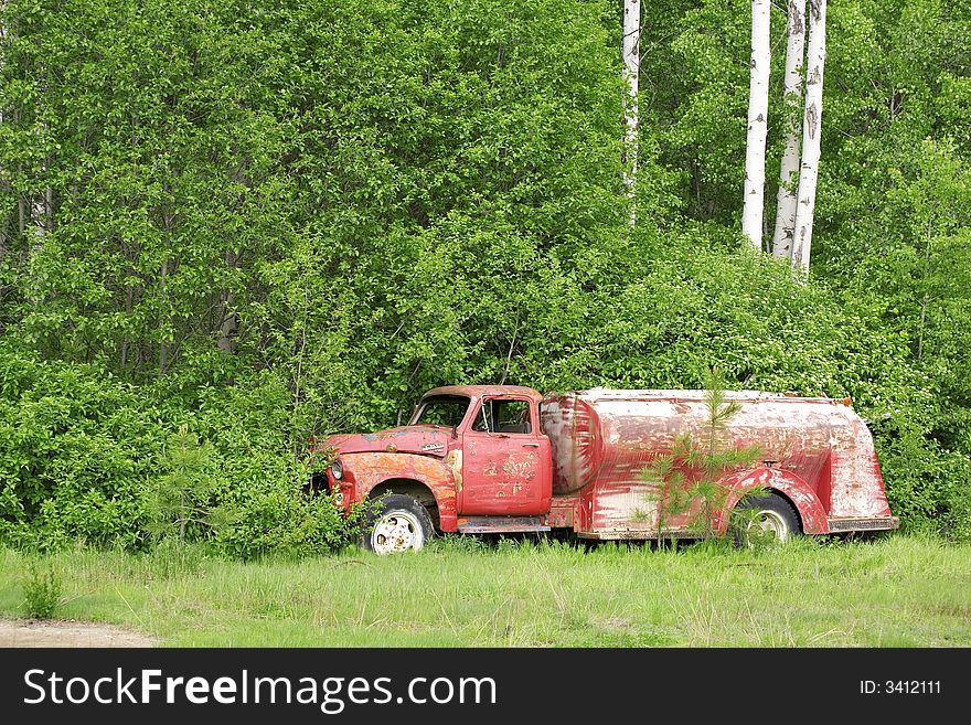 Abandoned old truck by the forest. Abandoned old truck by the forest