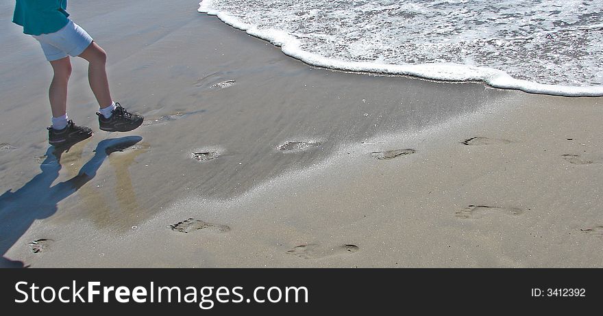 Playing at the ocean, trying to keep our shoes wet, watching our footprints fade into the sand. Playing at the ocean, trying to keep our shoes wet, watching our footprints fade into the sand.