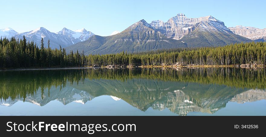 Reflexion of rockies mountains in the lake