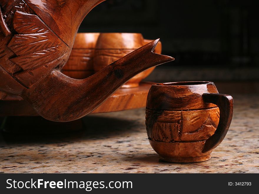 Wooden tea cup or coffee cup pouring.