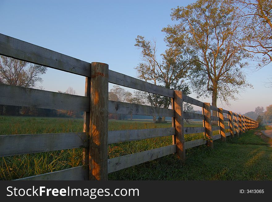 Old wooden fence at sunrise
