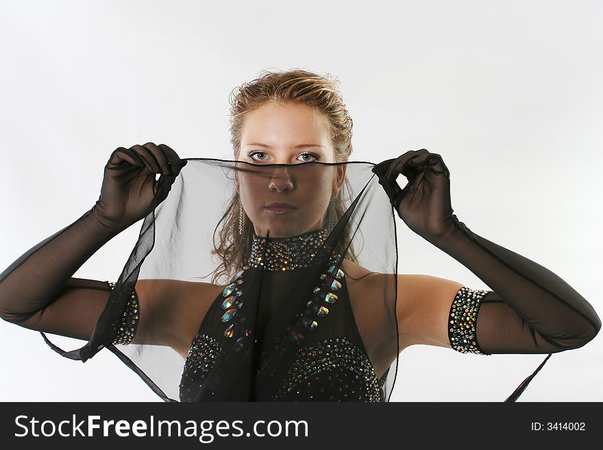 The young woman dancing ball dance in a black dress. The young woman dancing ball dance in a black dress