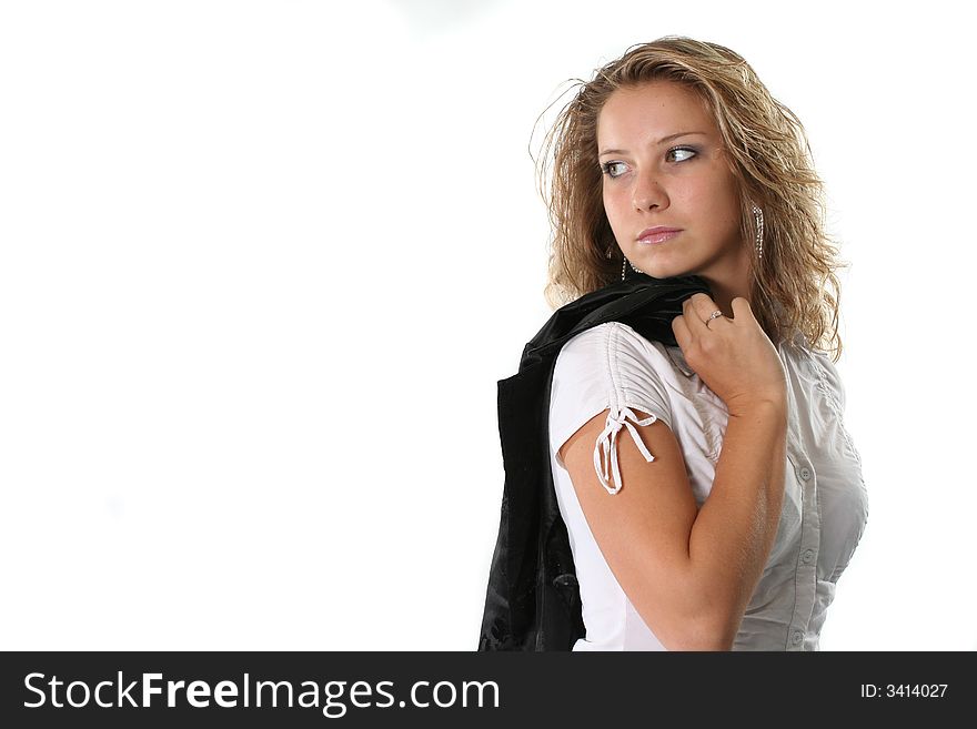 The young woman looks back on a white background. The young woman looks back on a white background