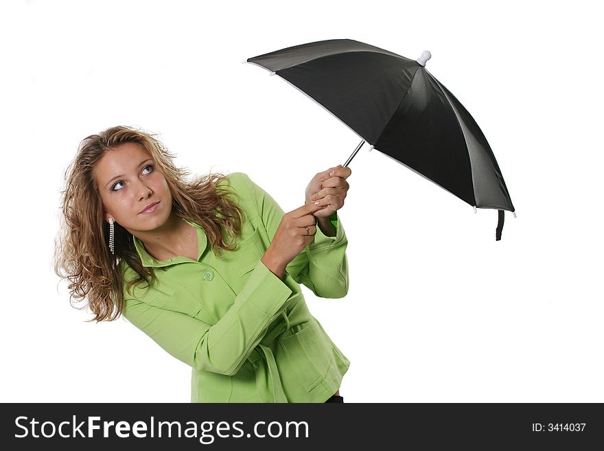 The isolated beautiful girl holds a black umbrella. The isolated beautiful girl holds a black umbrella