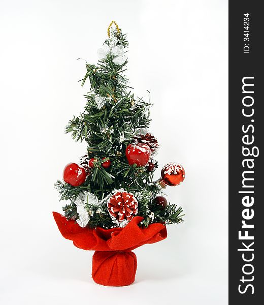 Isolated artificial plastic christmas tree on the white background