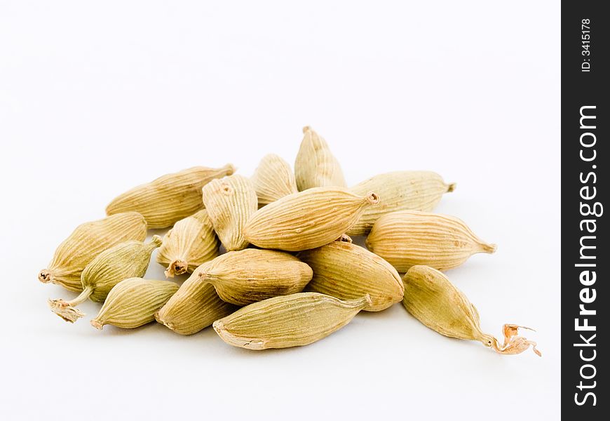 Still life of a pile of cardamom isolated on white background