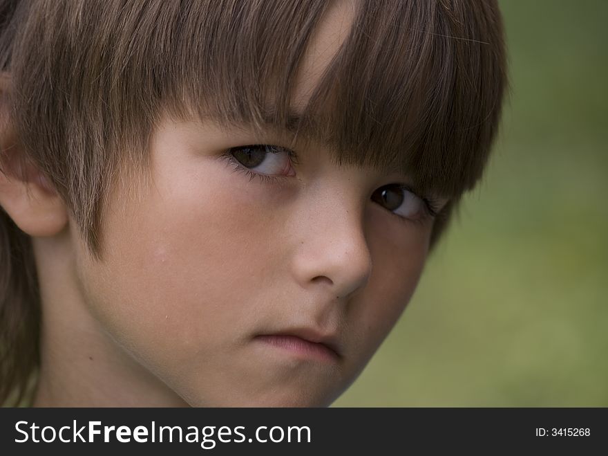 Young boy with unhappy face, injury boy