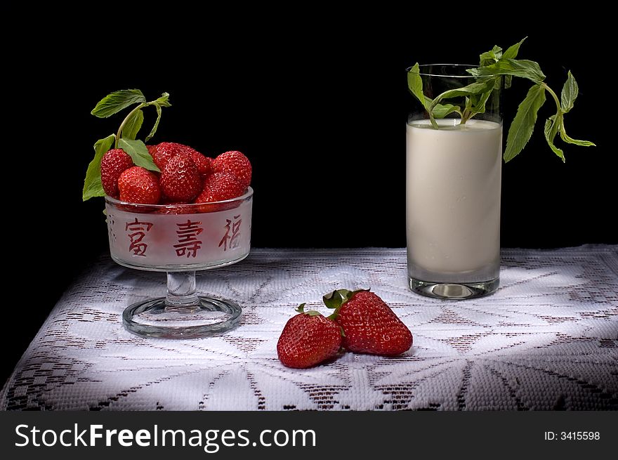 Tasty red strawberry with mint and milk. Tasty red strawberry with mint and milk