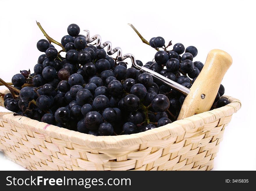 Closeup of bunch of black juicy grapes with drop of water over white