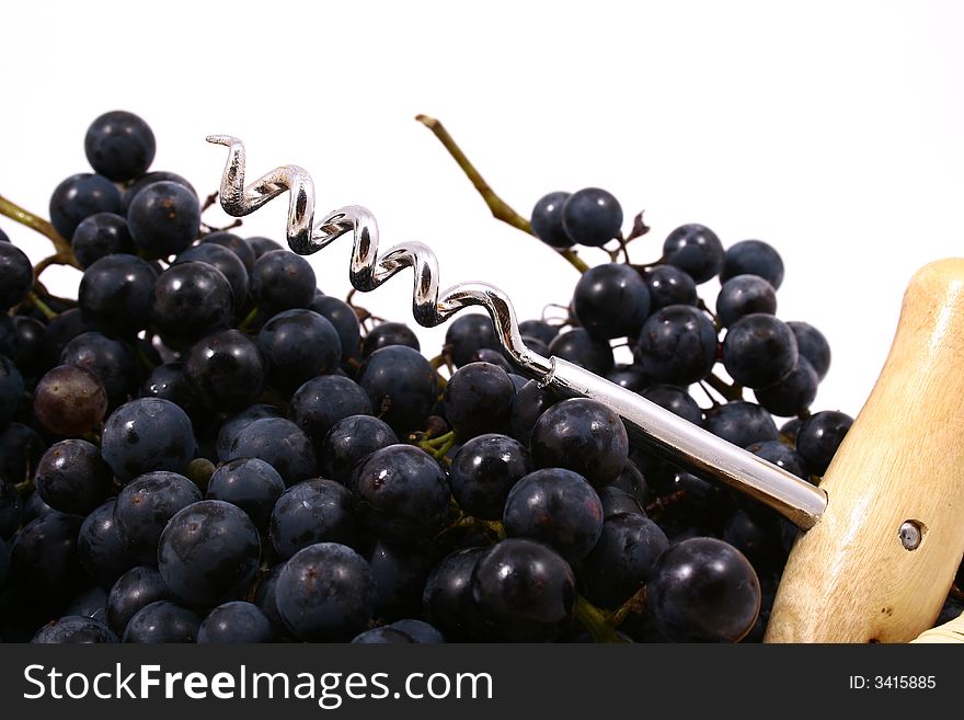 Closeup of bunch of black juicy grapes with drop of water over white