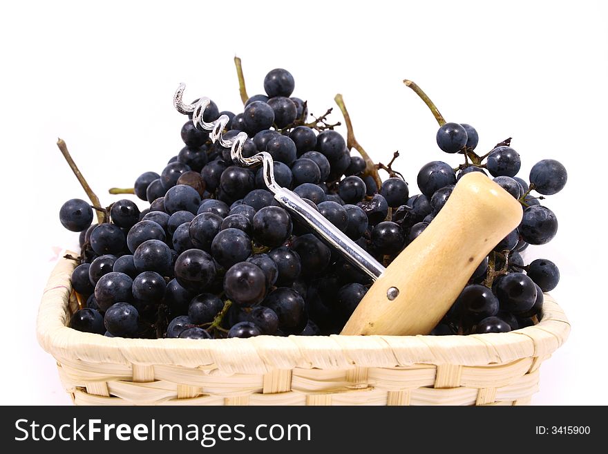 Closeup of bunch of black juicy grapes with drop of water over white